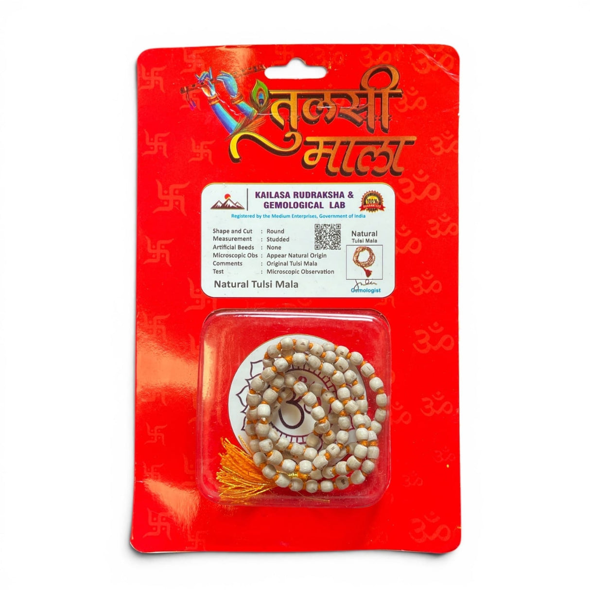 White and gold-tipped natural tulsi mala beads necklace in clear packaging with red cardboard for japa meditation