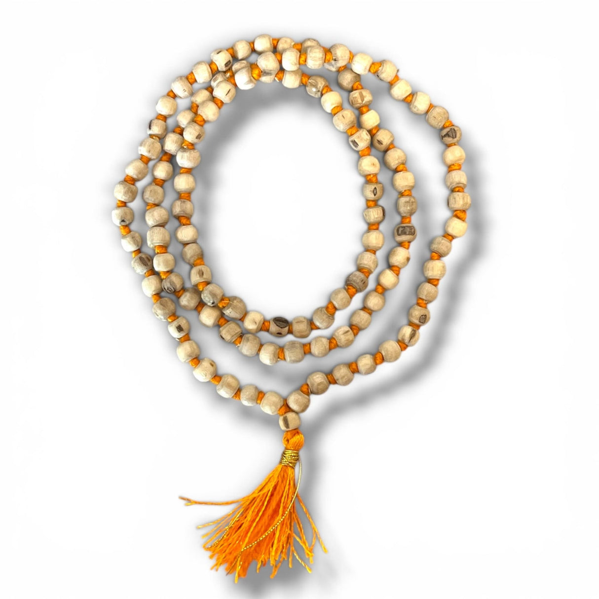 A coiled 5 mm tulsi mala beads necklace with cream wooden beads and an orange tassel for meditation and spiritual wear