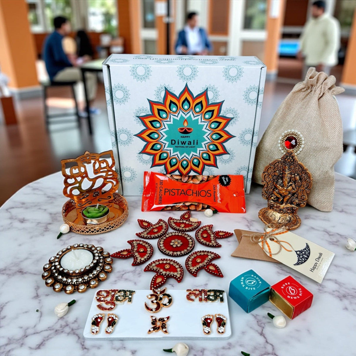 Diwali gift box with festive decor snacks and treats for celebrations