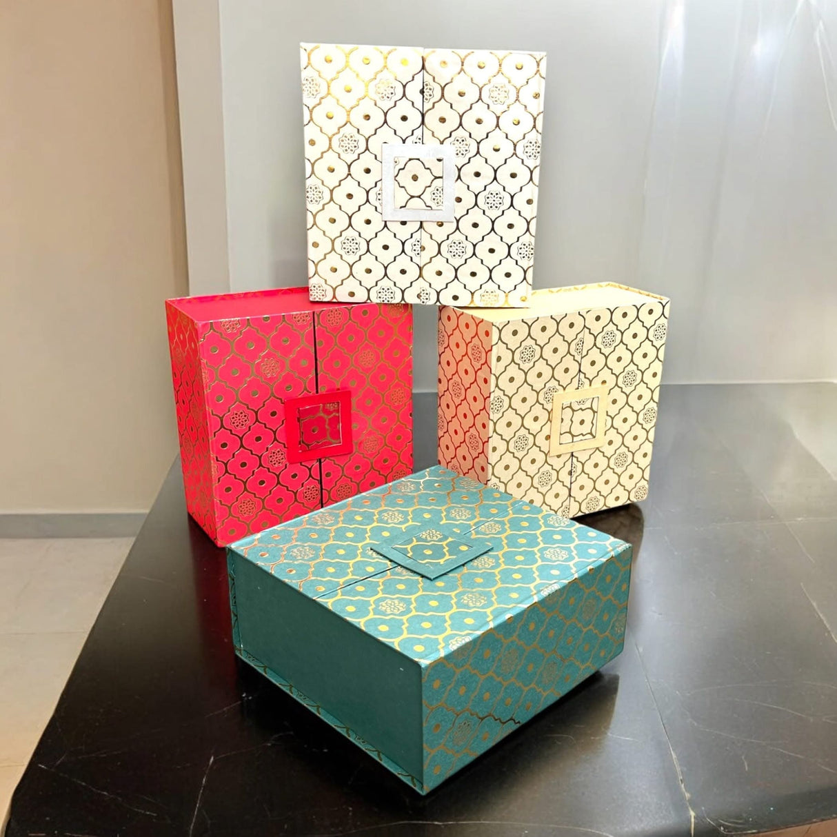 Colorful patterned gift boxes from the Ultimate Rakhi Gift Hamper for special occasions