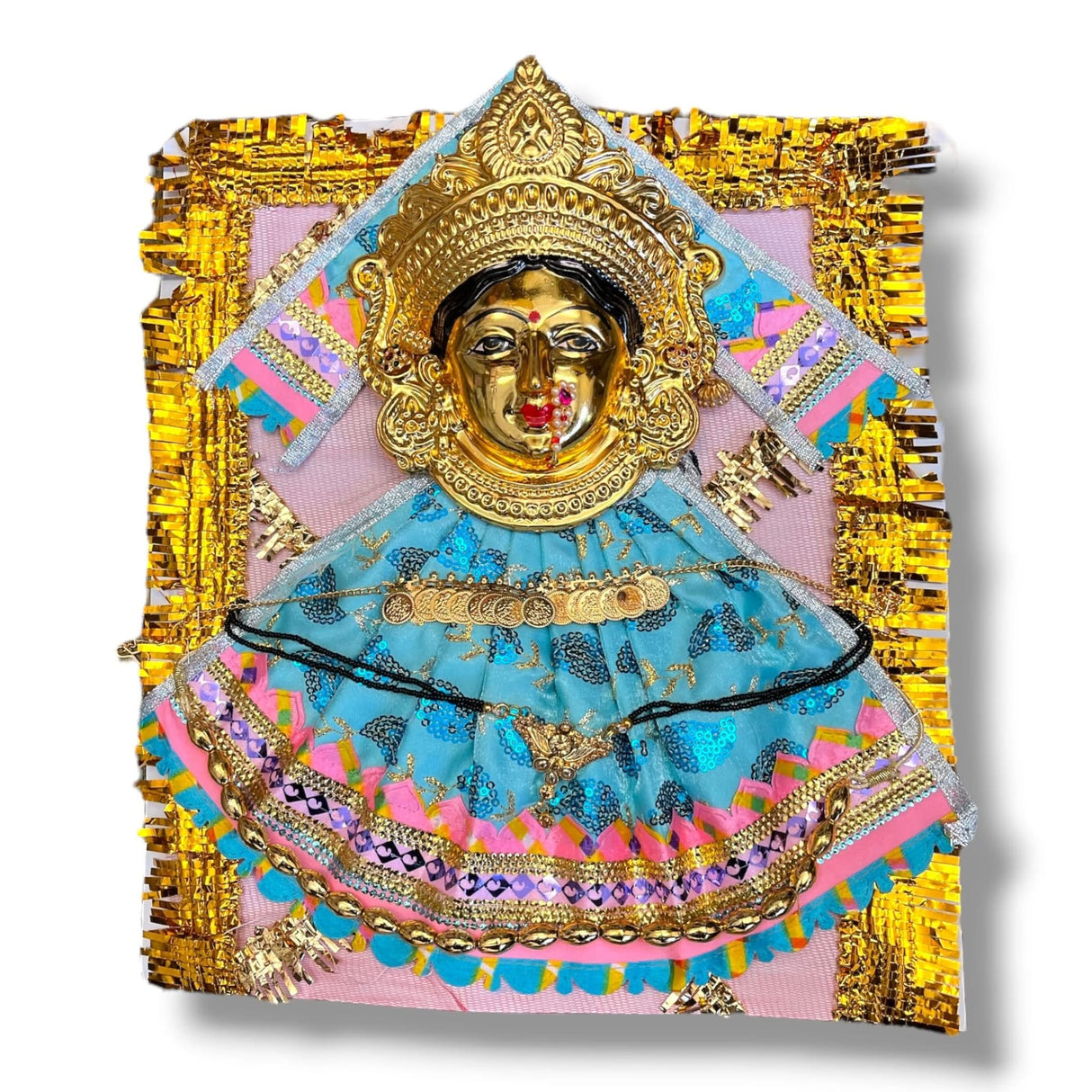 Golden Hindu deity figurine adorned with colorful clothing and jewelry for religious rituals
