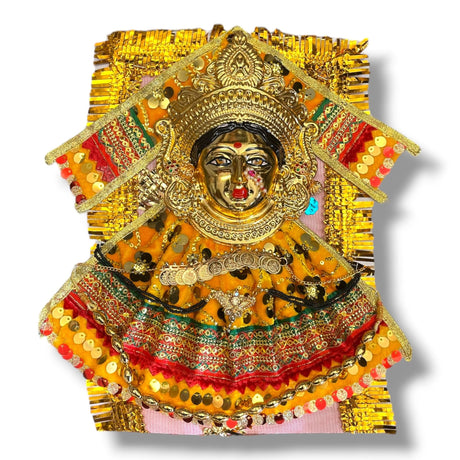 Ornate golden Hindu deity statue with jewelry, velvet dress, for Navaratri worship