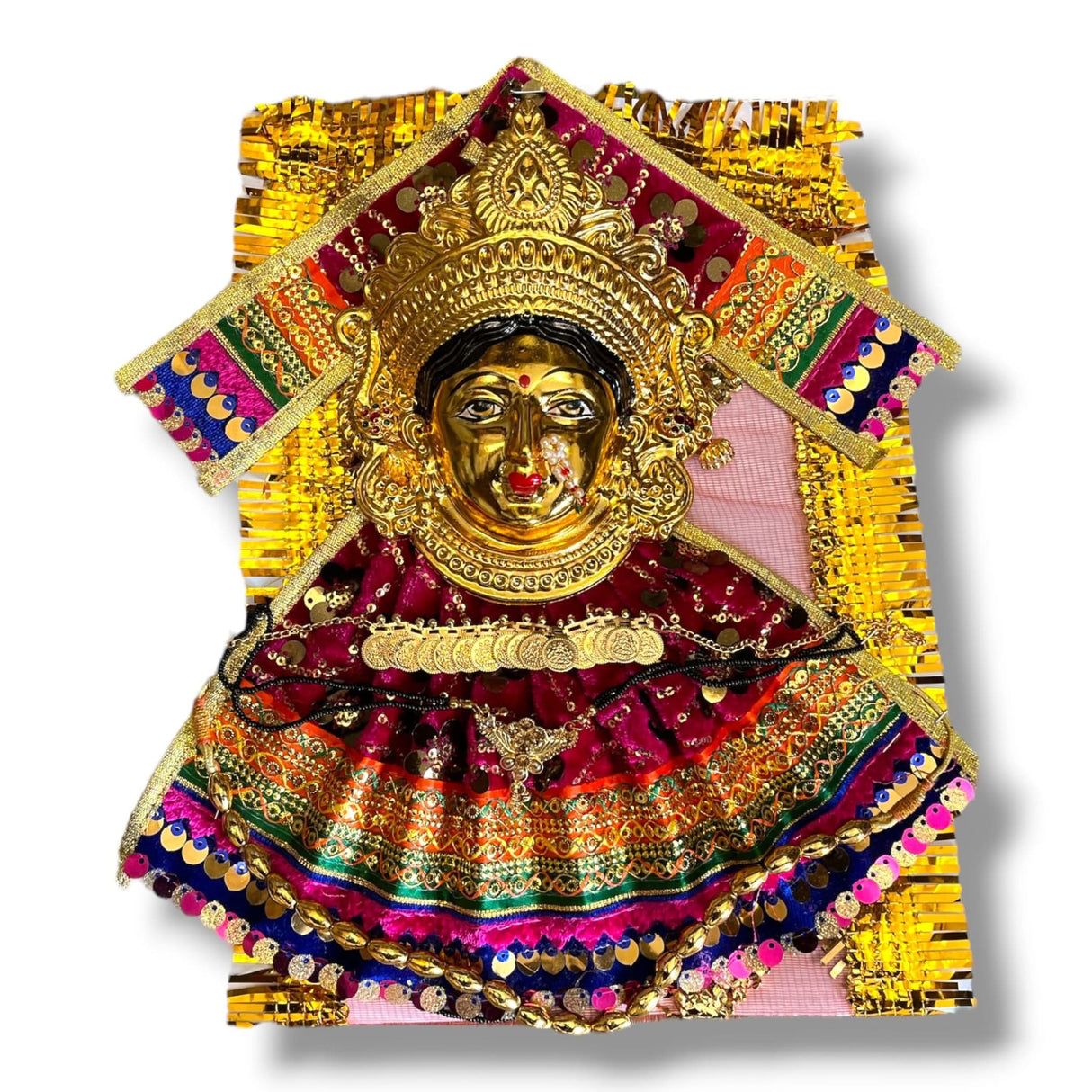 Ornate golden Hindu deity statue with jewelry and velvet dress for religious worship