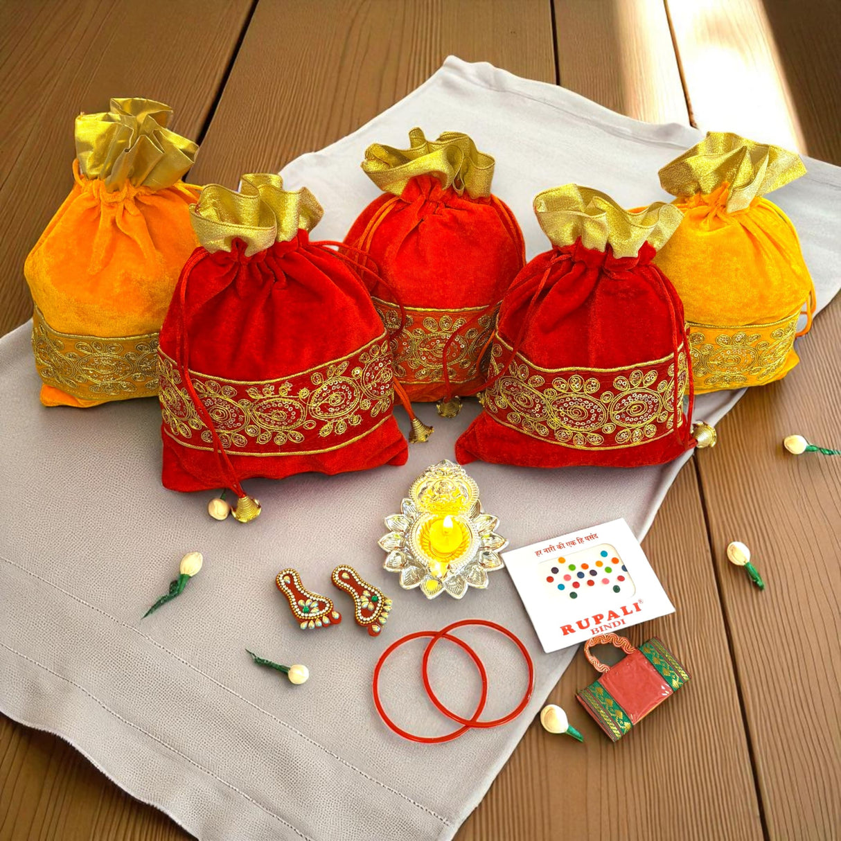 Colorful Indian-themed gift bags with decorative designs for festive celebrations