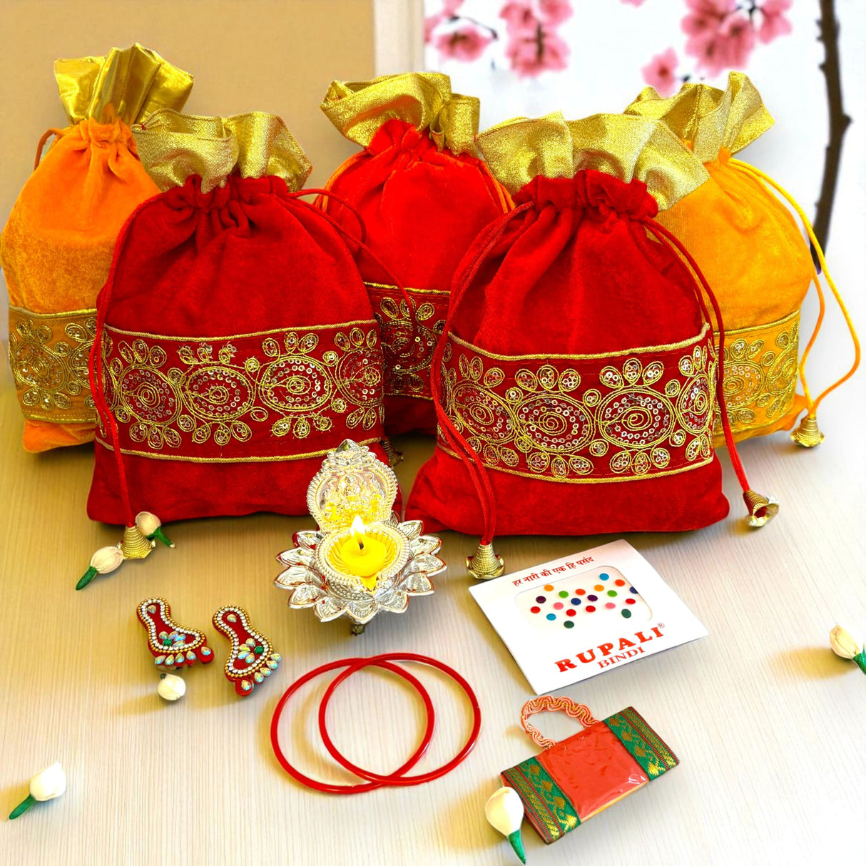 Festive red and gold gift bags featured in Varalakshmi Vratham Pooja Gift Hamper
