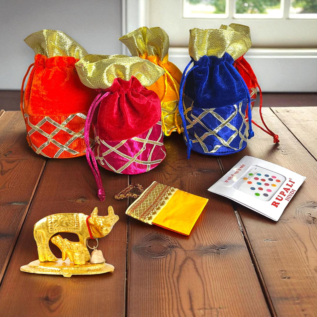 Colorful gift bags with gold accents for Varalakshmi Vratham and festive occasions