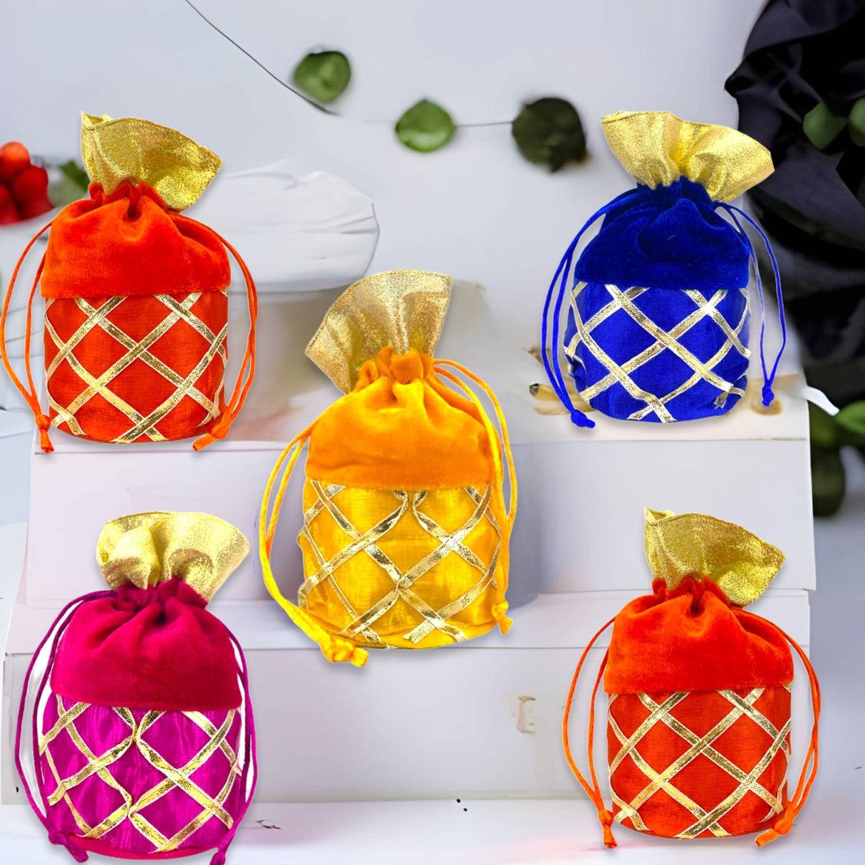 Colorful velvet gift bags with gold accents suitable for Navaratri and religious occasions