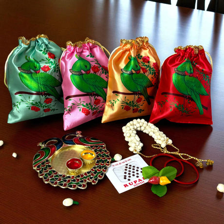 Colorful parrot-themed gift bags with Rakhi and Puja items for Navaratri and Hindu ceremonies