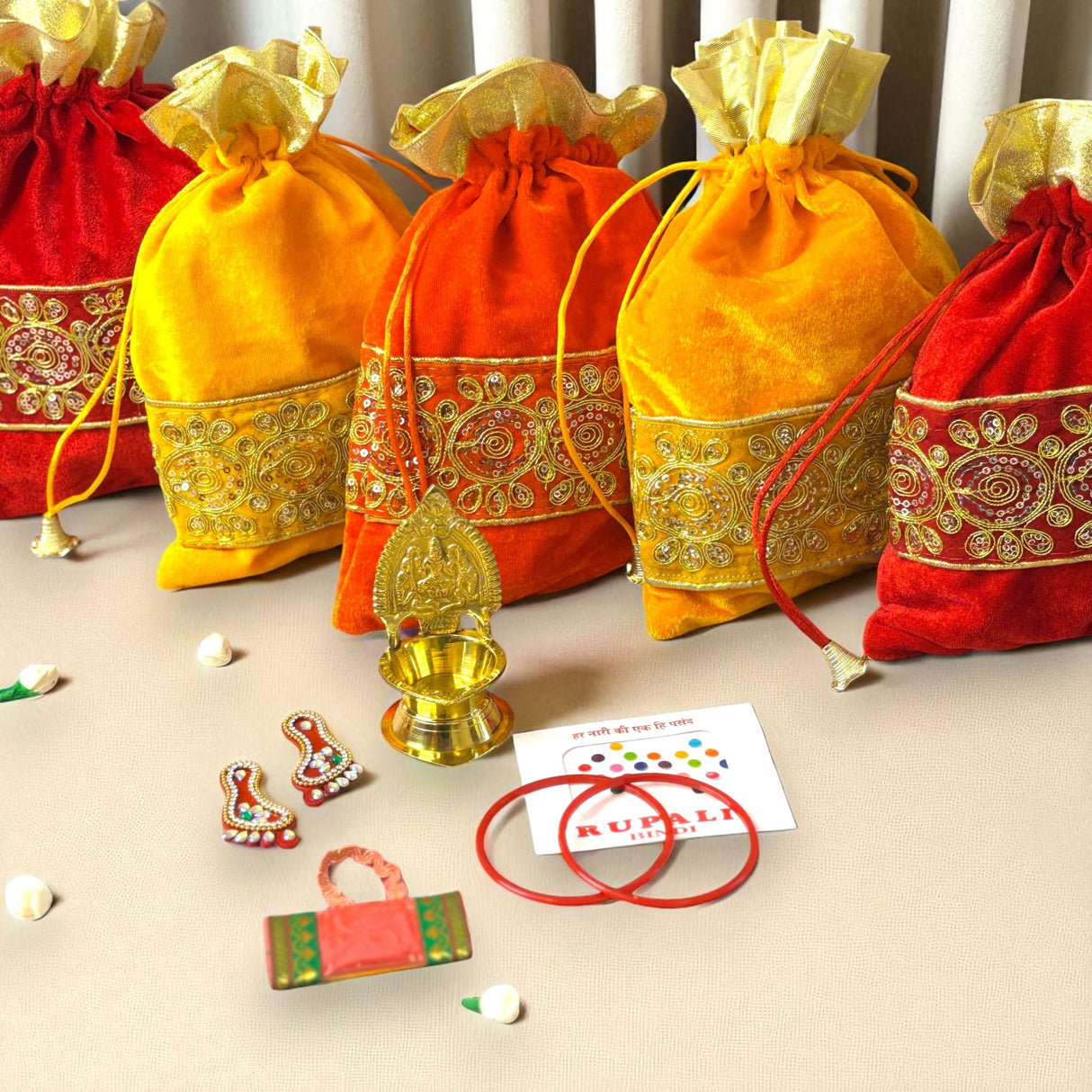 Colorful velvet gift bags with gold trim for Navaratri Vratha and festive occasions