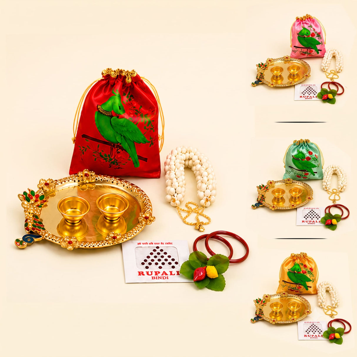 Red satin drawstring potli bag with green parrot design included in Varalakshmi Vratham gift hamper for women
