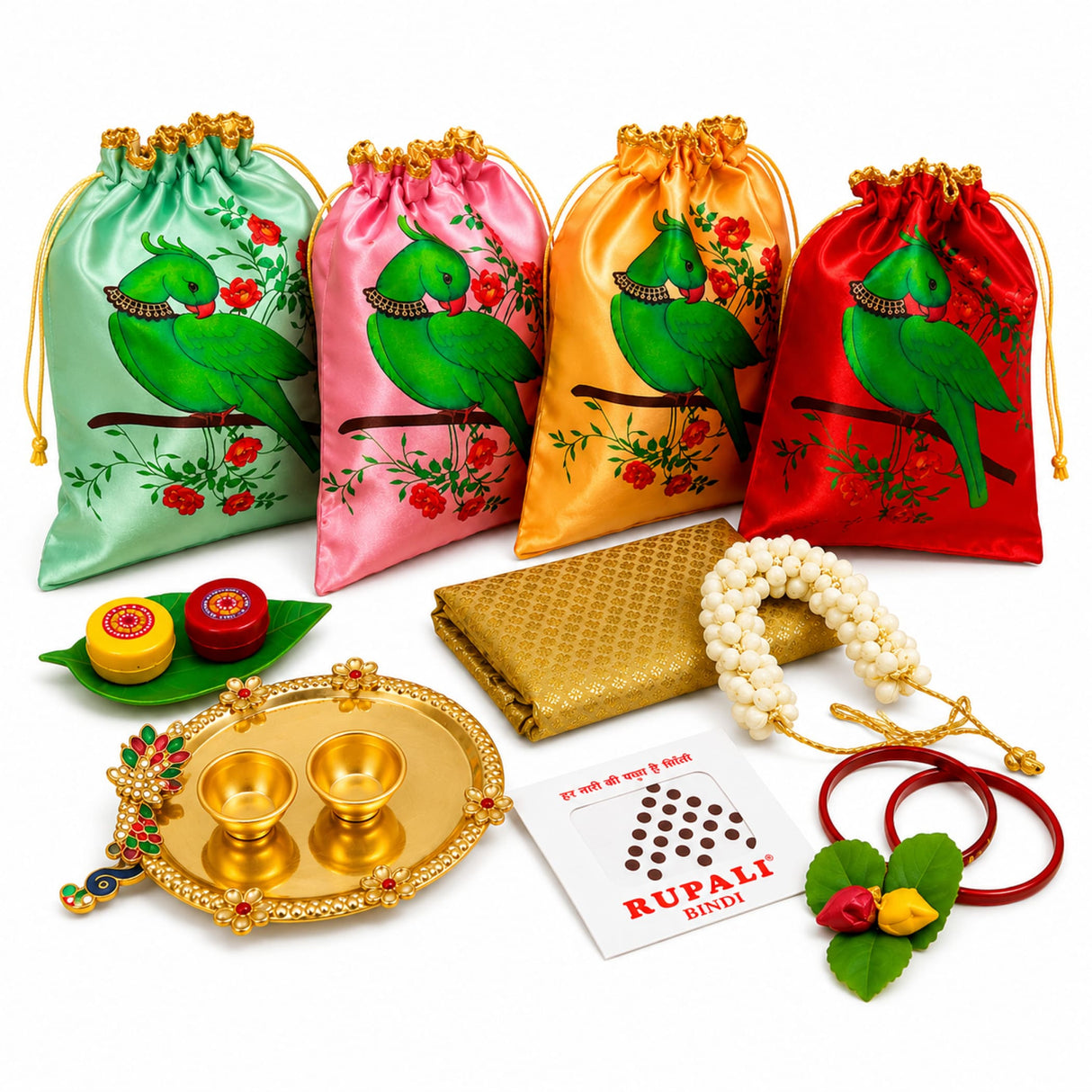 Set of four satin drawstring potli bags in mint pink gold and red with green parrots and jeweled necklaces for varalakshmi vratham gift hamper