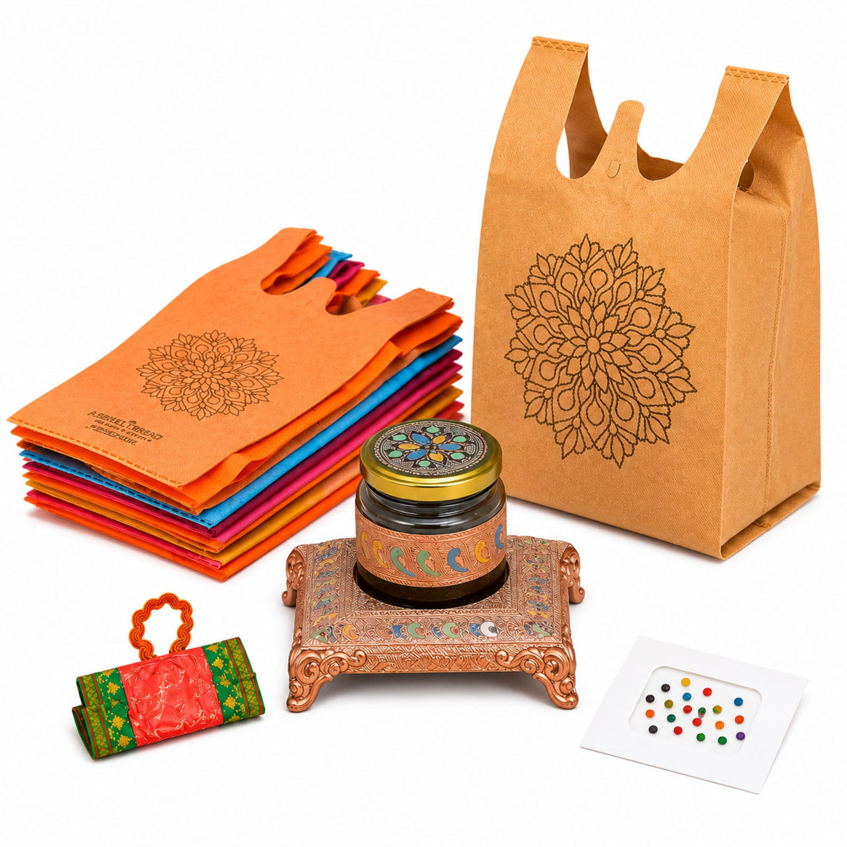 Ornate copper-colored floral engraved stand holding a glass jar with colorful mosaic and golden lid in varalakshmi vratham gift hamper