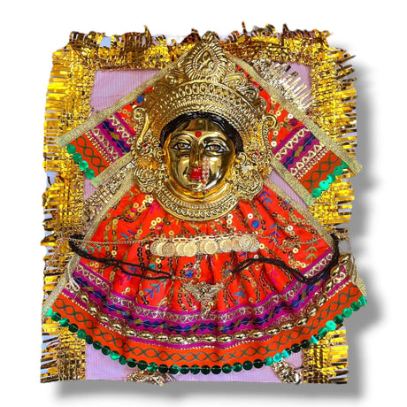 Ornate golden Hindu deity statue with intricate embroidery dress and jewelry for Navaratri Pooja