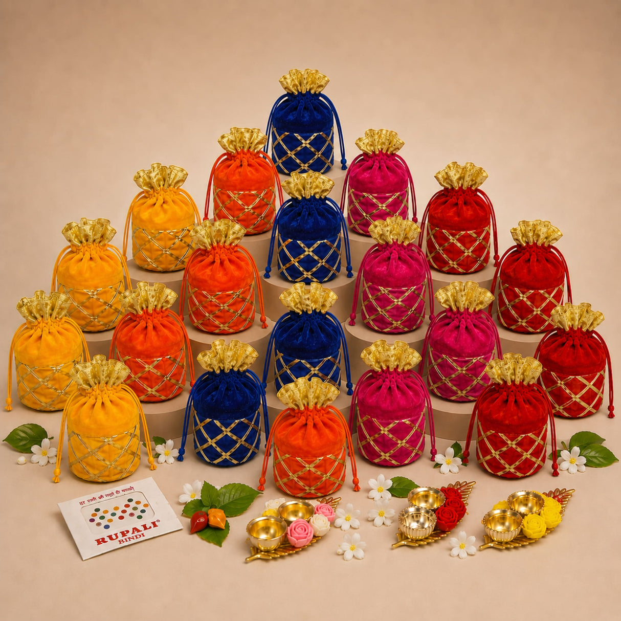 A collection of vibrant orange red pink and blue velvet drawstring pouches with gold lattice embroidery for religious gifts