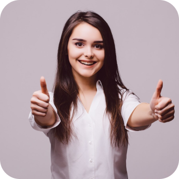 Smiling woman with long dark hair giving thumbs up with both hands.