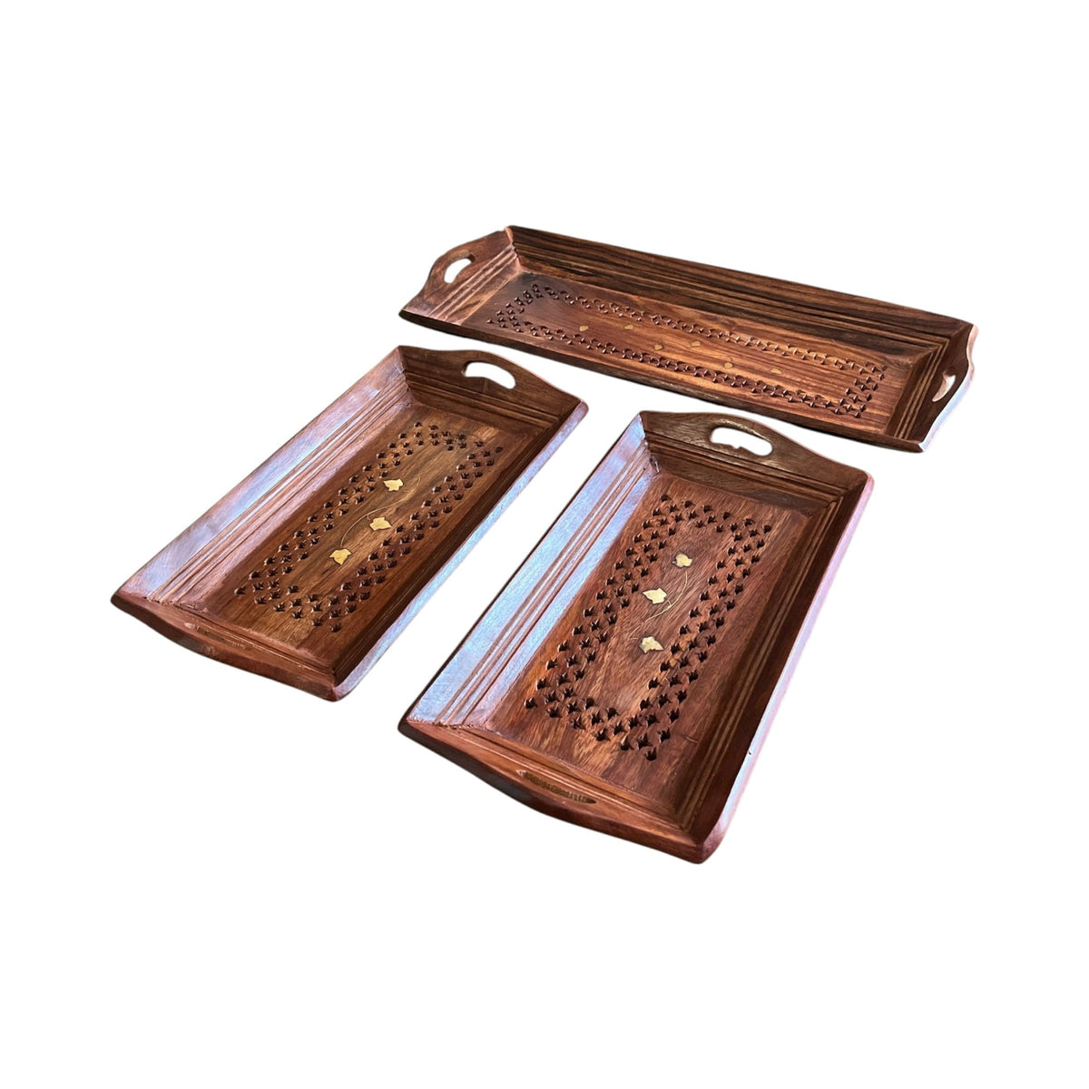 Set of three hand-painted wooden serving trays with carved patterns and gold accents for rustic kitchen decor