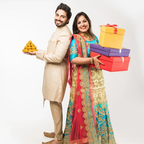 Bride and groom in traditional Indian wedding attire showcasing Indian wedding favors in the USA
