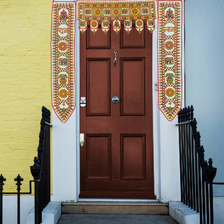 Door Toran set of 3 that is beautifully decorated at the house entrance.