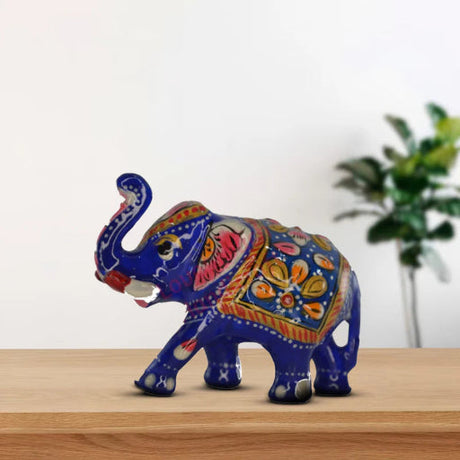 Beautifully handcrafted Elephant at the table top for the home decor that you can get from LoveNspire.