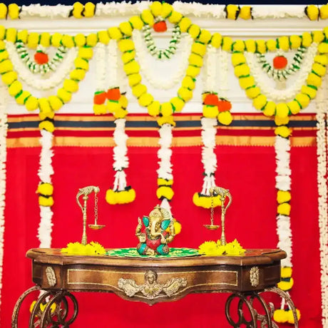 Ornate wooden table with decorative objects and candles from Michigan-based LoveNspire online ethnic store