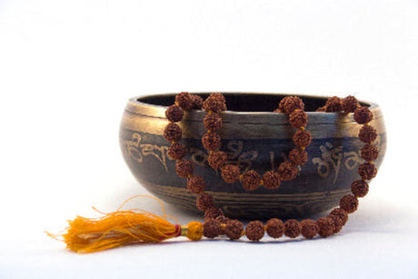 Tibetan singing bowl along with the rudraksha mala.