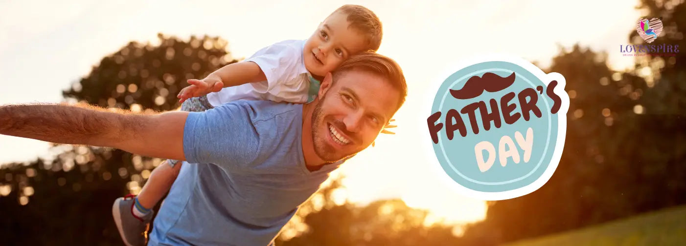 A man joyfully lifts a child into the air against a vibrant sunset backdrop.