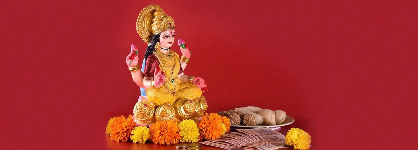 Statue of Goddess Lakshmi with flowers for Varalaxmi Pooja celebration of divine feminine power.