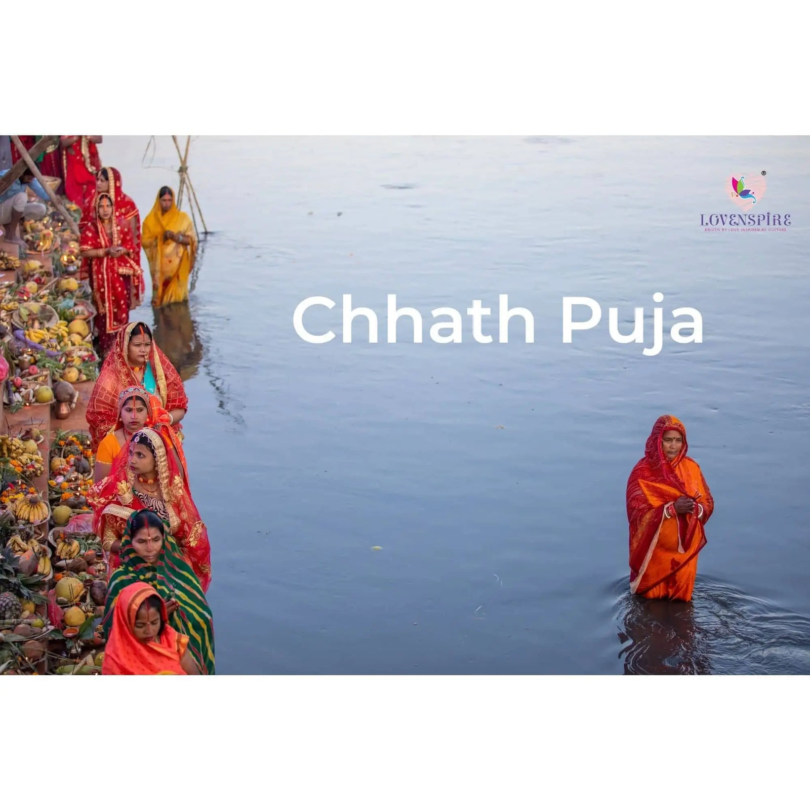 Women in colorful saris performing Chhath Puja rituals at the water’s edge