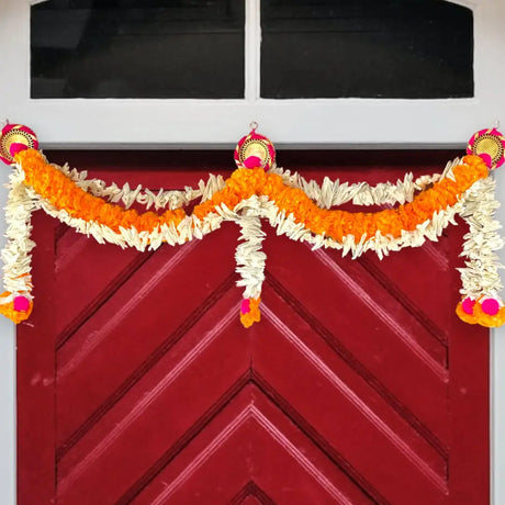 Colorful pom-pom garland as a door toran showcasing Rajasthani toran tradition