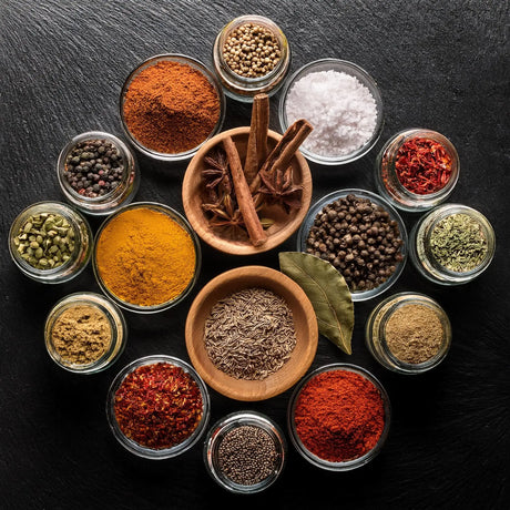 Any standard masala box usually contains essential spice blends like garam masala, turmeric, cumin, coriander, red chili powder, mustard seeds, and fenugreek as a complete option for kitchen essentials.