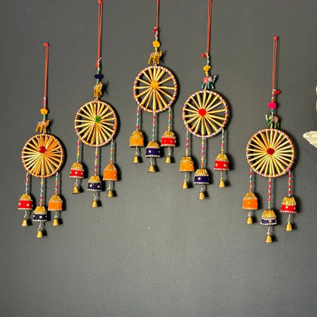 Colorful hanging wind chimes with circular designs and bells for vastu shastra Indian home decor
