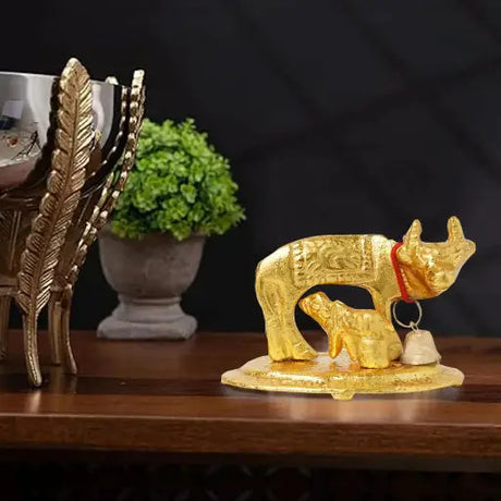 Brass Kamdhenu statue with calf that you can get from LoveNspire.