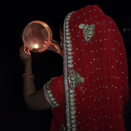 Karwa Chauth is observed by fasting from sunrise to moonrise, performing evening puja rituals with a sargi thali, and breaking the fast with traditional foods after sighting the moon.