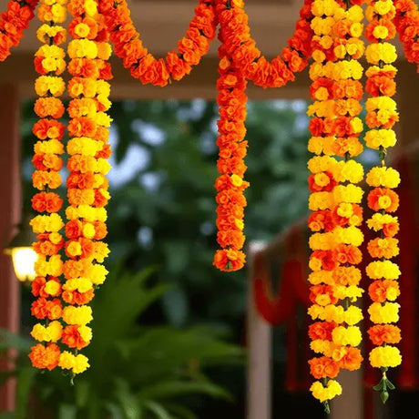 Bright yellow and orange artificial marigold garlands hanging as festive Diwali decorations, symbolizing celebration and tradition.