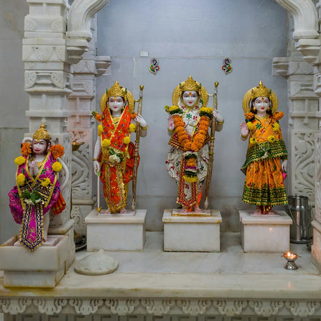 Colorful Hindu deity statues adorned with flowers for Ram Navami celebration of Lord Rama