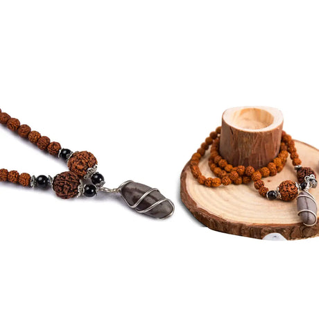 Beaded necklace with stone pendant featuring a Narmadeshwar Shivling mala for spiritual significance