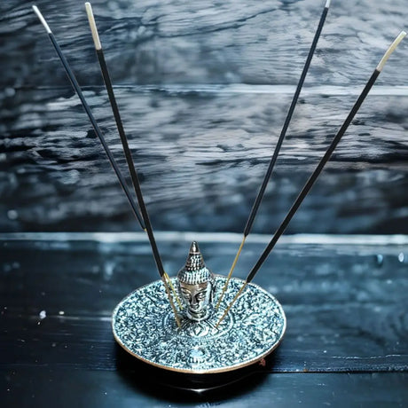 Silver Buddha head incense holder with floral patterns, ideal for incense stick holders and creating a serene environment