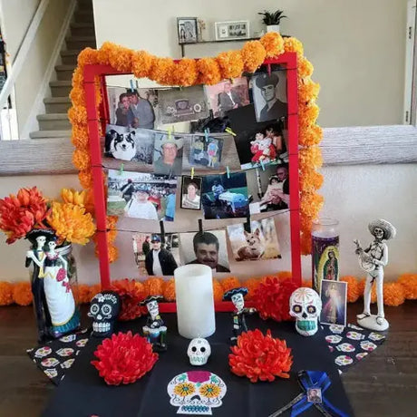 A vibrant arrangement of marigold flowers in rich oranges and yellows, set against a colorful backdrop, symbolizing the spirit of Día de los Muertos.
