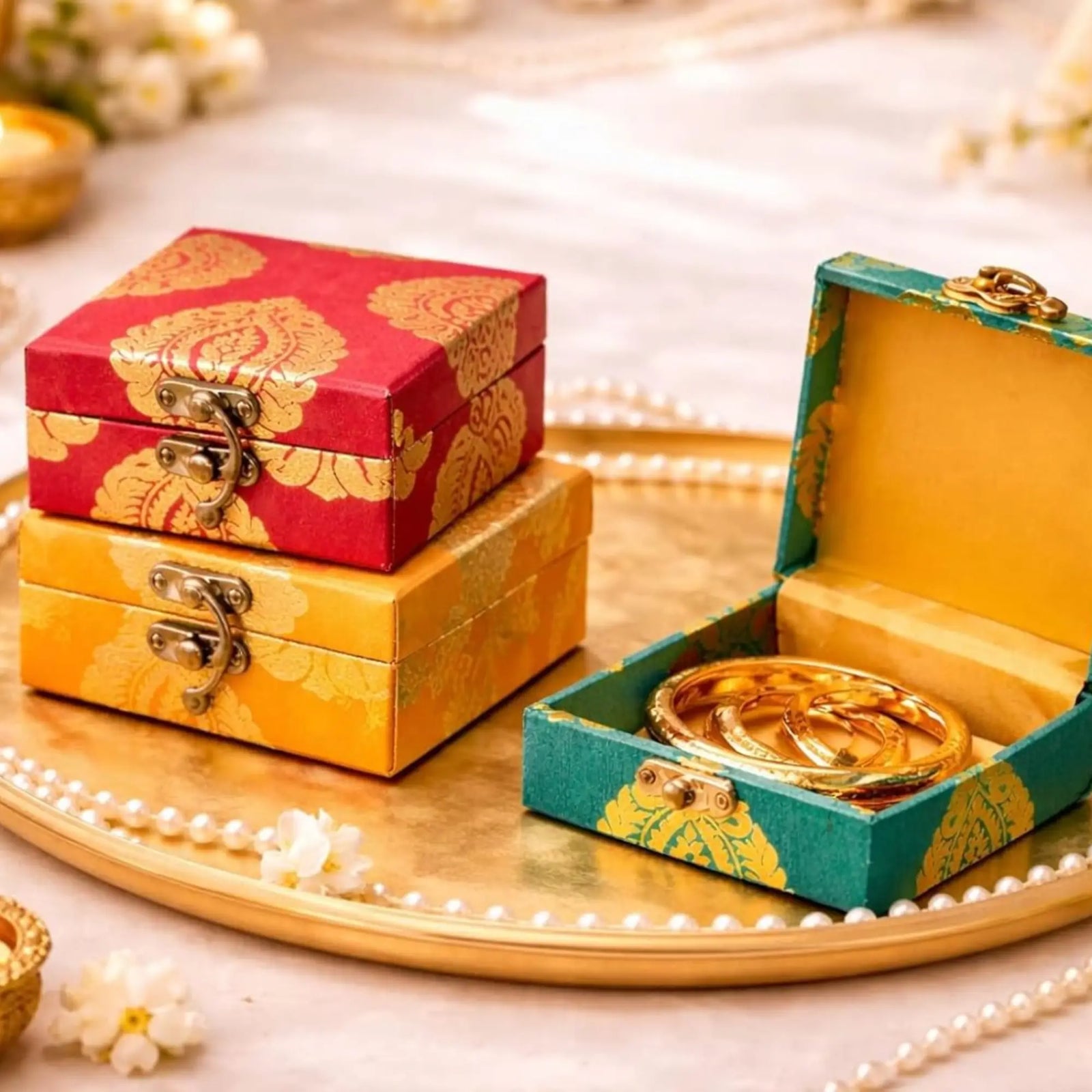 Vibrant red kumkum powder in decorative golden containers ideal for raksha bandhan ethnic gifts and pooja gift hampers