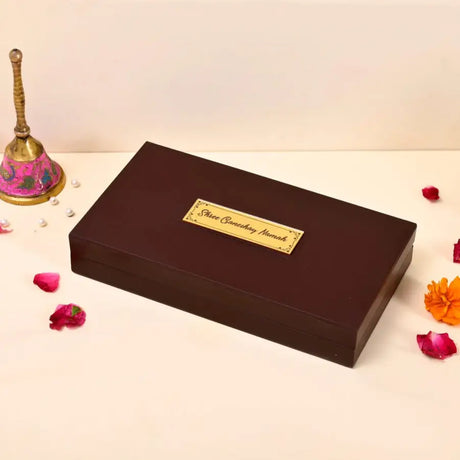 Dark brown rectangular wooden box with golden nameplate, ideal as festival gifts for love n spire’s Indian festival