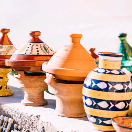 Colorful Moroccan tagine pots with intricate designs and conical lids for authentic Indian handicrafts
