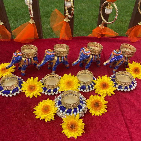 Decorative elephant figurines with baskets, ideal housewarming return gifts for Indian housewarming ceremonies