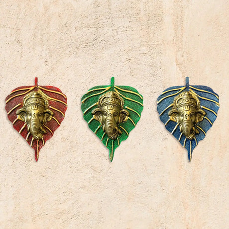 Decorative ganesh leaf wall pendants with Ganesha figures on red, green, and blue backgrounds