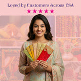 Woman in green outfit holds 5 ornate paisley shagun money envelopes