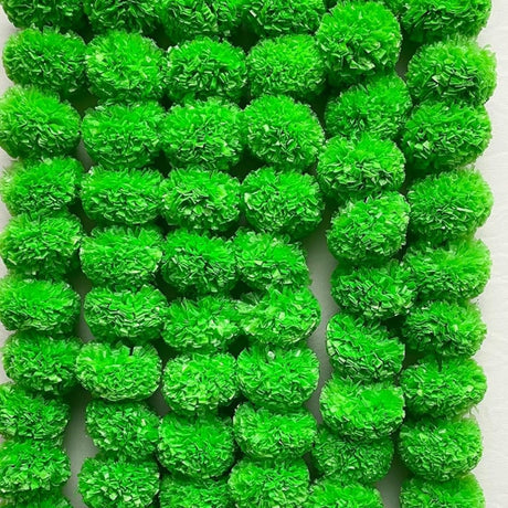 Bright green fluffy crinkled paper pom-poms in 5-string marigold garland