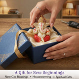 Cream and red resin Ganesha figurine with gold details for car dashboard