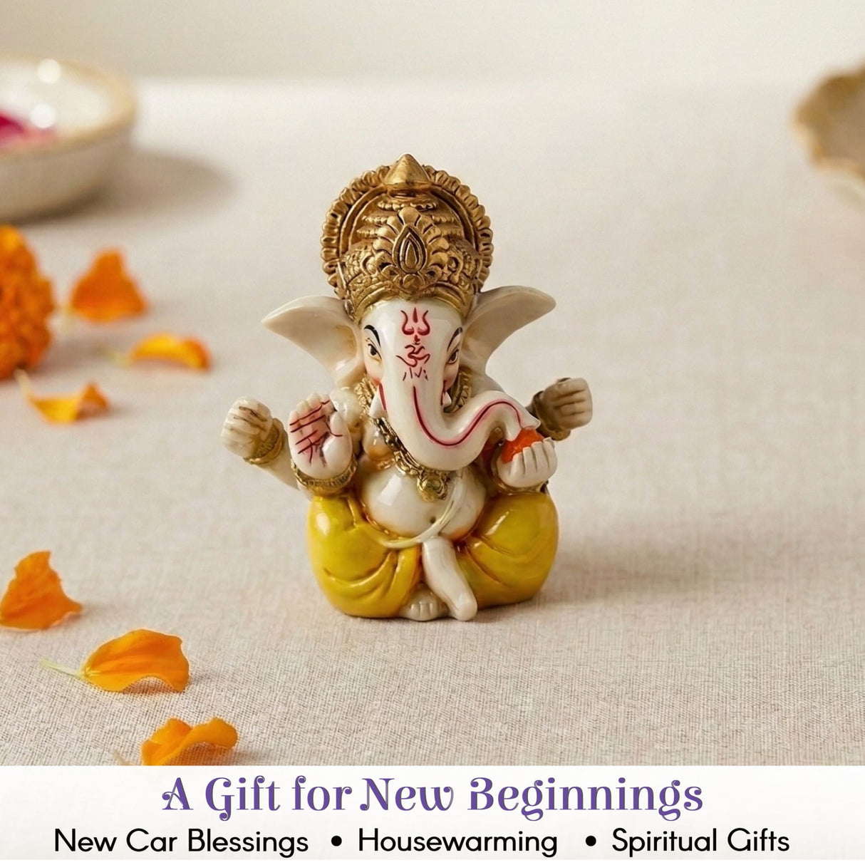 A small 1 ct acrylic ganesha statue figurine with white body golden crown yellow dhoti for car dashboard and home decor