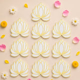 White and gold lotus flower rangoli cutouts arranged in a grid for reusable home decor during indian festivals and weddings
