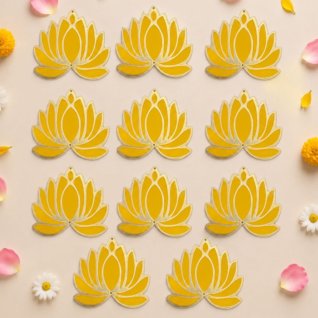 Yellow lotus flower rangoli cutouts with gold-trimmed edges for reusable home decor during indian festivals and weddings