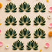 Dark green and gold lotus flower rangoli cutouts in decorative lotus shape for reusable home decor during indian festivals